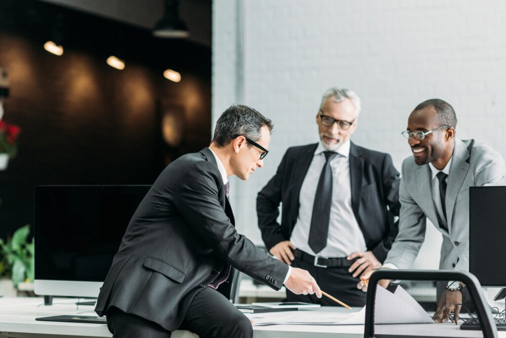 multiethnic businessmen discussing new business strategy on meeting in office